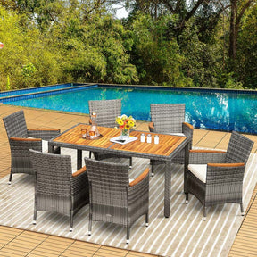 7 Pcs Rattan Wicker Outdoor Patio Dining Furniture Set with Acacia Wood Table & 6 Cushioned Armchairs
